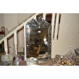 A Venetian style wall mirror with etched decoratio