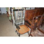 A part black painted stick back elbow chair