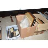 Three boxes of picture frames and prints