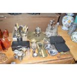A silver plated six bottled cruet stand; a box of