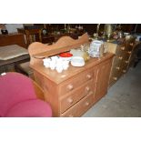 A Victorian stripped pine sideboard fitted three d