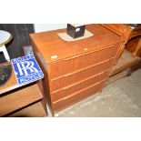 A teak four drawer chest