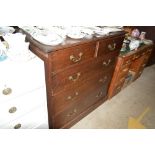 An oak chest fitted two short over three long draw