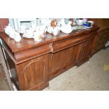 A Victorian mahogany sideboard fitted three frieze