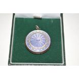 A silver and purple enamelled locket