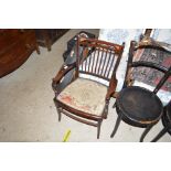 An Edwardian and inlaid mahogany salon elbow chair