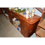 A Victorian mahogany breakfront sideboard fitted s