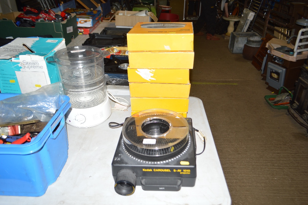 A Kodak carousel and various slide trays