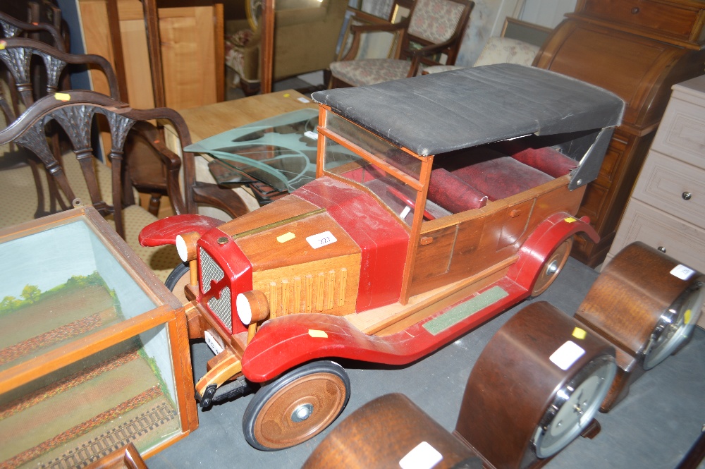 A large hand built wooden vintage car