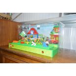 A Lego Duplo retail display box with push button,