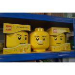 Three boxed Lego storage heads