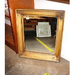 An antique gilt framed wall mirror, raised foliate decoration, 70cm x 60cm overall