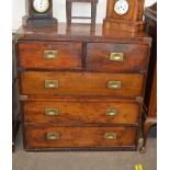A 19th Century teak military chest, in two sections, fitted two short and three long drawers with