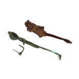 An antique iron bronze figure, and an antique betel nut cutter handle