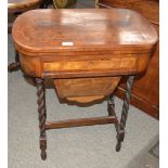 A Victorian walnut and box wood strung games/work table, having fold over swivel top inlaid with