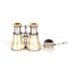 A pair of mother of pearl and polished metal cased French binoculars; and a 19th Century glass