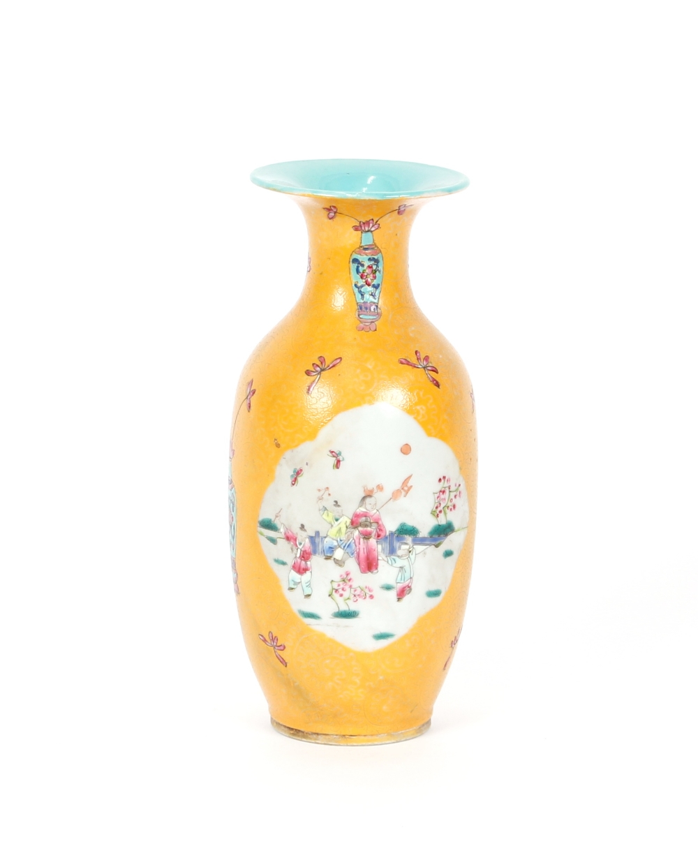 A Chinese famille rose baluster vase, having panels decorated with figures in garden settings flying