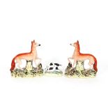 A pair of 19th Century Staffordshire pottery figures of red foxes; and a small 19th Century