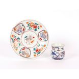A Japanese Imari pattern plate, decorated flowers and vignettes of mythological beasts; and a