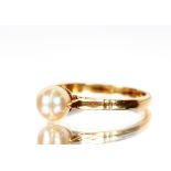A 18ct gold pearl set ring, approx. total weight 3gms