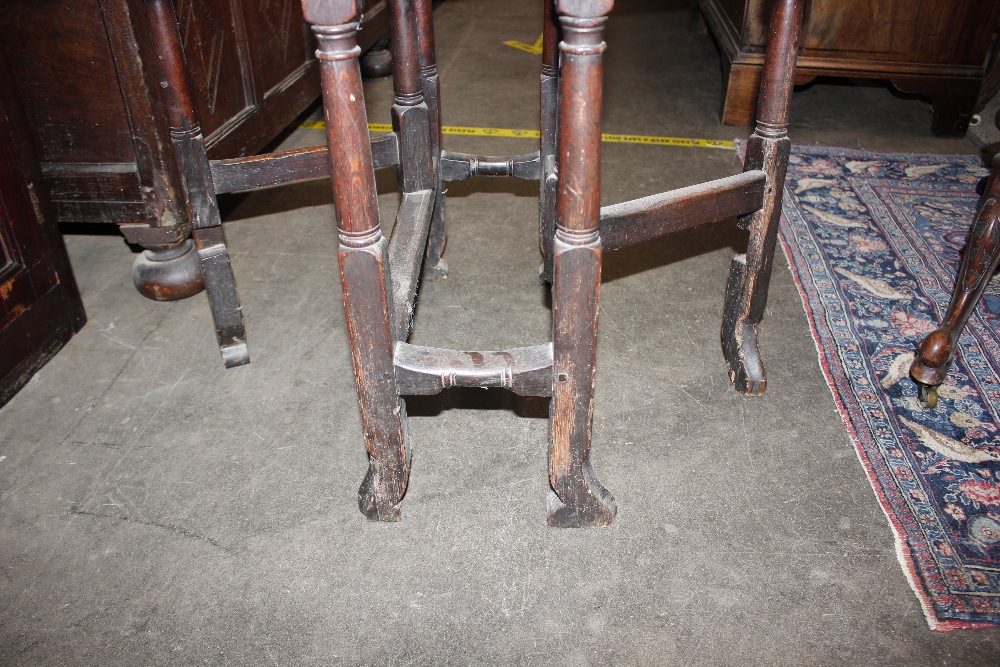 An 18th Century oak gate leg table, raised on turned supports terminating in Braganza type feet, - Image 15 of 23