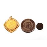 A 1966 Sovereign, in yellow metal mount, approx. 12gms total weight; an 1876 copper ⅓ farthing and