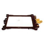 A George III mahogany fret carved wall mirror, in the Chippendale manner, surmounted by gilt eagle