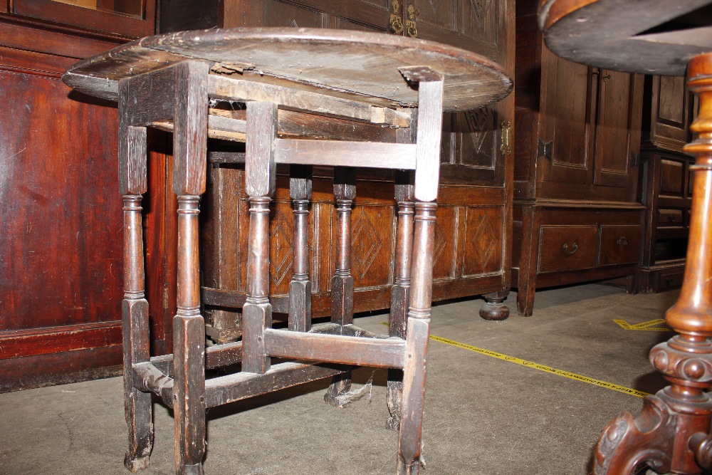 An 18th Century oak gate leg table, raised on turned supports terminating in Braganza type feet, - Image 16 of 23