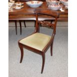 A set of four Regency mahogany bar back dining chairs, having upholstered drop in seats raised on