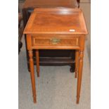 A pair of mahogany and cross banded lamp tables, fitted single drawers, raised on turned tapering