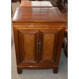 A pair of oriental side cabinets, enclosed by wicker panelled doors, 56cm wide x 50cm deep x 79cm