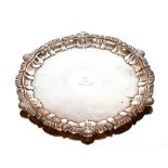 A George V silver salver, having gadrooned and shell border, engine turned decoration and central