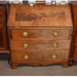 A Georgian mahogany cross banded bureau, the fall front opening to reveal a fitted interior, three