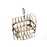 A Victorian six division silver toast rack, having beaded loop handle raised on scrolled feet,