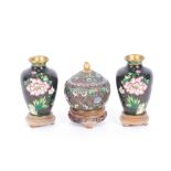 A pair of oriental cloisonné vases, having Prunus decoration 16cm high; and a cloisonné vase and