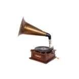 A wind-up gramophone, complete with brass horn, needles, and a 78rpm record
