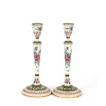 A pair of 19th Century famille rose decorated candlesticks, 35cm high