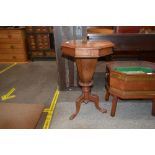 A Victorian burr walnut octagonal sewing table, the hinged lid opening to reveal a baize lined