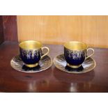 Six Royal Worcester cobalt blue and gilt decorated coffee cans and saucers