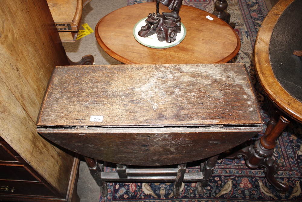 An 18th Century oak gate leg table, raised on turned supports terminating in Braganza type feet, - Image 2 of 23