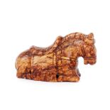 A Chinese russet jade carving of a recumbent horse, 7cm long