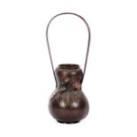 A Japanese bronze vessel, of basket weave gourd shape, applied leaf decoration and loop handle,