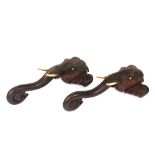 A pair of early 20th century carved hardwood elephant head wall hangings, 56cm