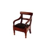 A 19th Century mahogany child's bar back elbow chair, with horsehair seat and raised on turned