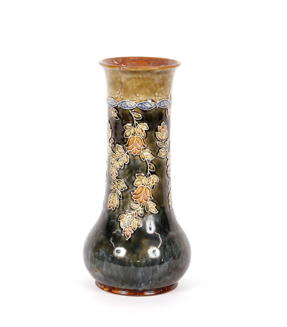 A Doulton baluster vase, having raised foliate decoration on a green and brown mottled ground,