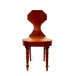 A 19th Century mahogany hall chair, having shaped back above solid seat raised on ringed turned