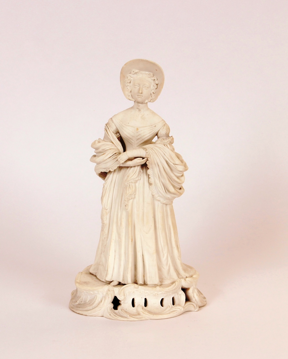 A mid-19th Century English porcelain biscuit ware figure, of a young Queen Victoria, finely