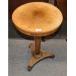 A 19th Century walnut circular topped occasional table, raised on octagonal column and quatrefoil