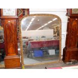 A large Victorian gilt framed overmantel mirror, with trailing ivy border, arched top, 162cm x 143cm