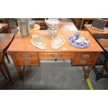 A 19th Century mahogany writing desk, fitted five drawers, raised on turned baluster supports